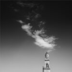 Bell tower of Lecce cathedral in Lecce, Italy, under diagonal cloud