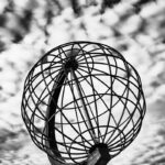 Iron globe against mackerel sky at North Cape, Norway.